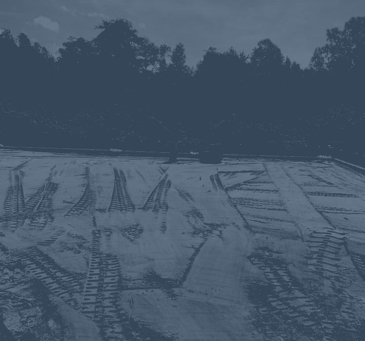 Dirt with Bobcat tracks with dark blue overlay